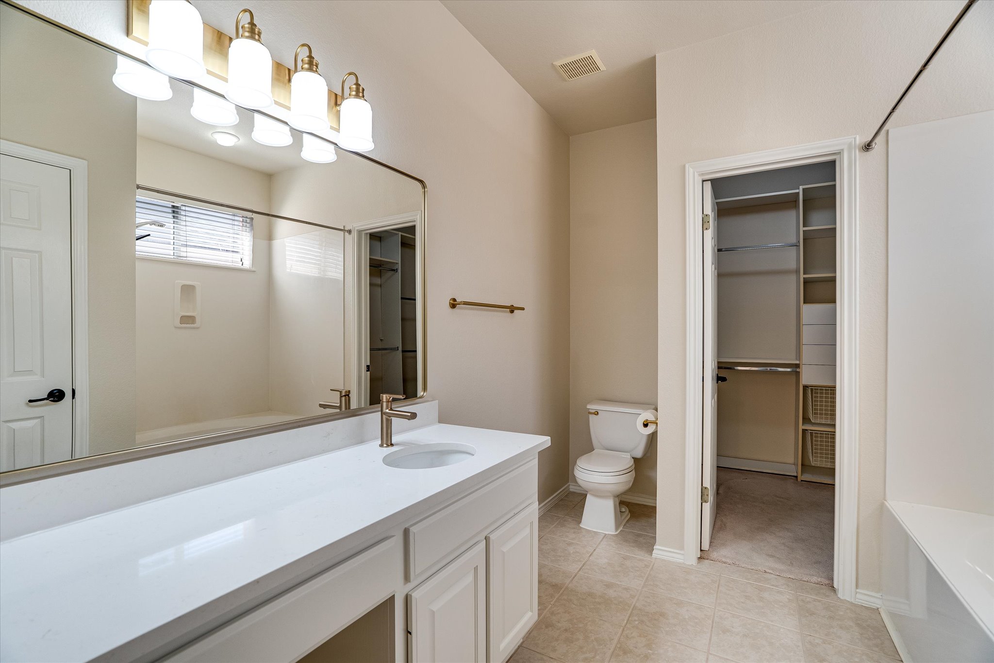 2207 Clover Ridge Drive Cedar Park, TX 78613 - Photo 14 of 25 Primary bathroom with quartz counters and tile floors