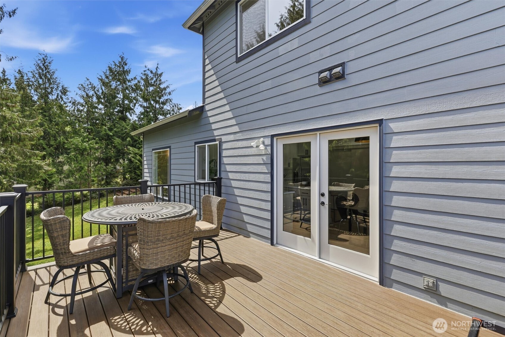 5523 East Wishon Road Snohomish, WA 98290 - Photo 31 of 39 a patio with table and chairs and potted plants