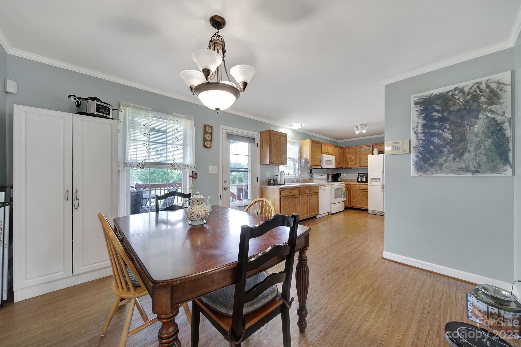 2674 State Rd S-29-330 Lancaster, SC 29720 - Photo 7 of 25 a view of a dining room with furniture and wooden floor