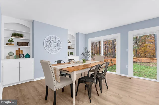 a view of a dining room with furniture and window