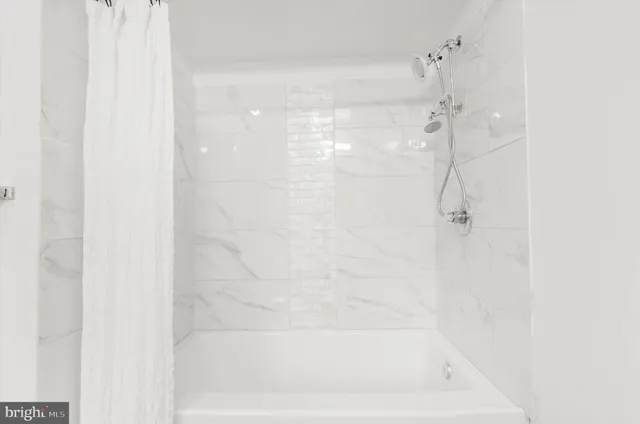 a close up of a bathtub curtain