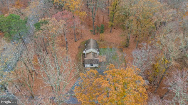 a aerial view of a house with a yard