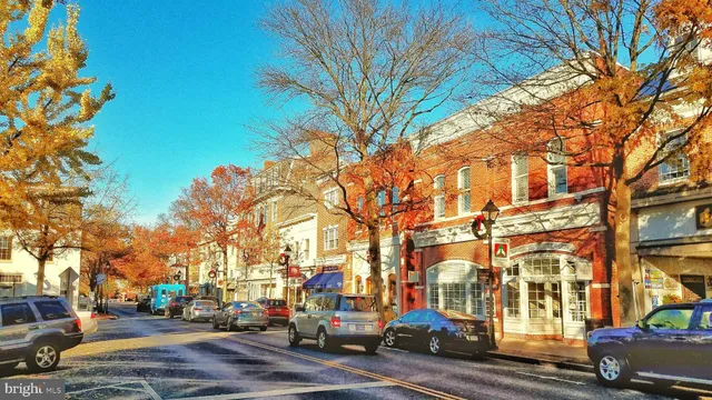 a city street lined with buildings and cars