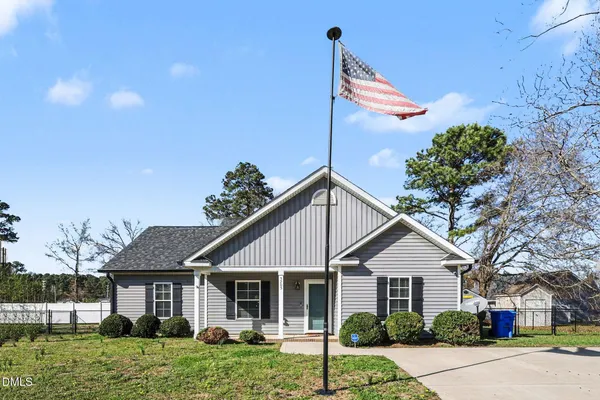 a front view of a house with a porch