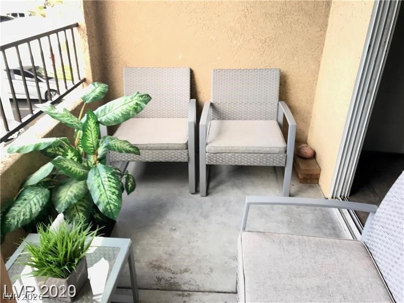 7885 West Flamingo Road, Unit 2162 Las Vegas, NV 89147 - Photo 19 of 34 This inviting patio area offers a perfect spot for relaxation and outdoor enjoyment.