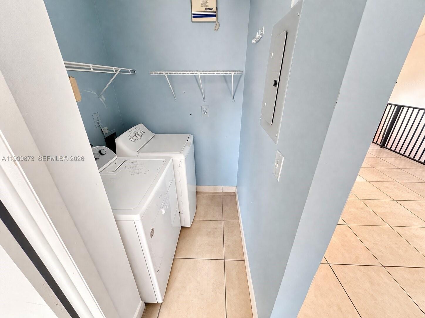 7952 West 29th Way, Unit 202 Hialeah, FL 33018 - Photo 7 of 12 a utility room with dryer and washer