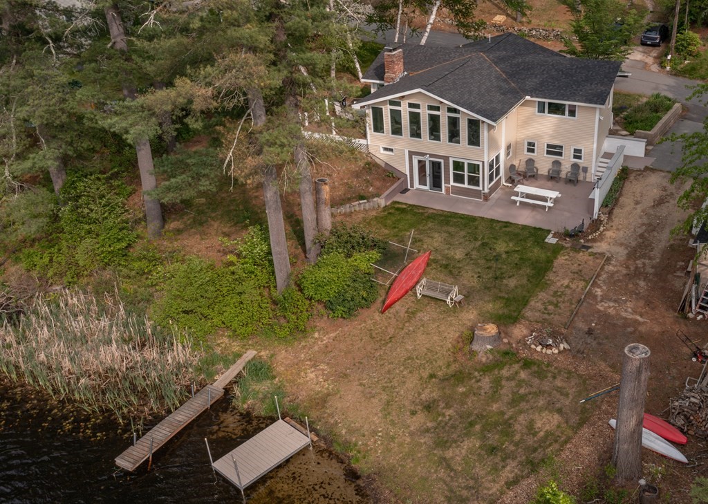 an aerial view of a house with a yard