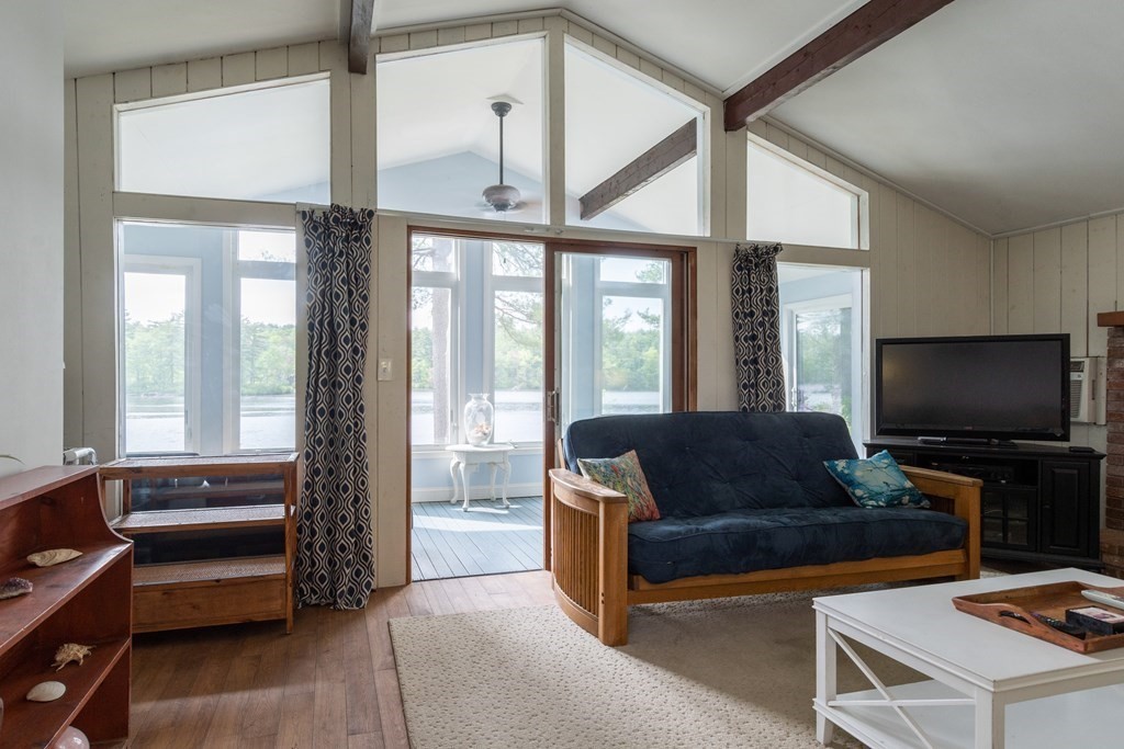 7 Sunset Drive Merrimack, NH 03054 - Photo 13 of 35 a living room with furniture and a flat screen tv