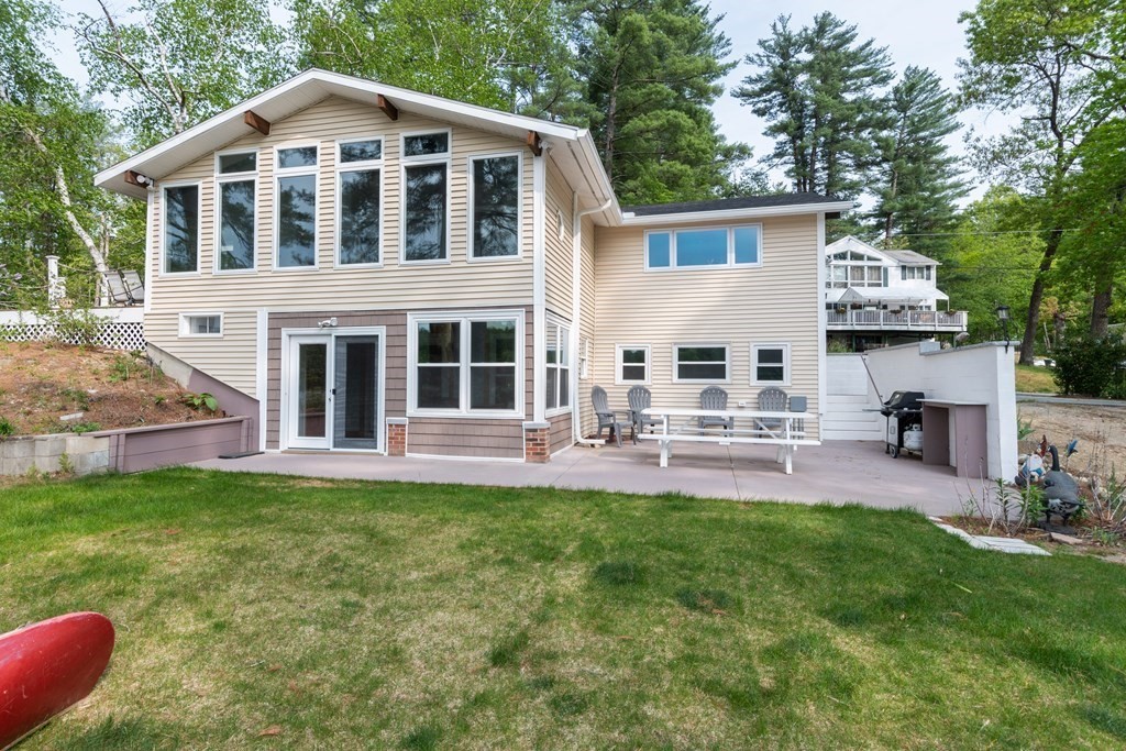 7 Sunset Drive Merrimack, NH 03054 - Photo 2 of 35 a view of a house with a yard and sitting area