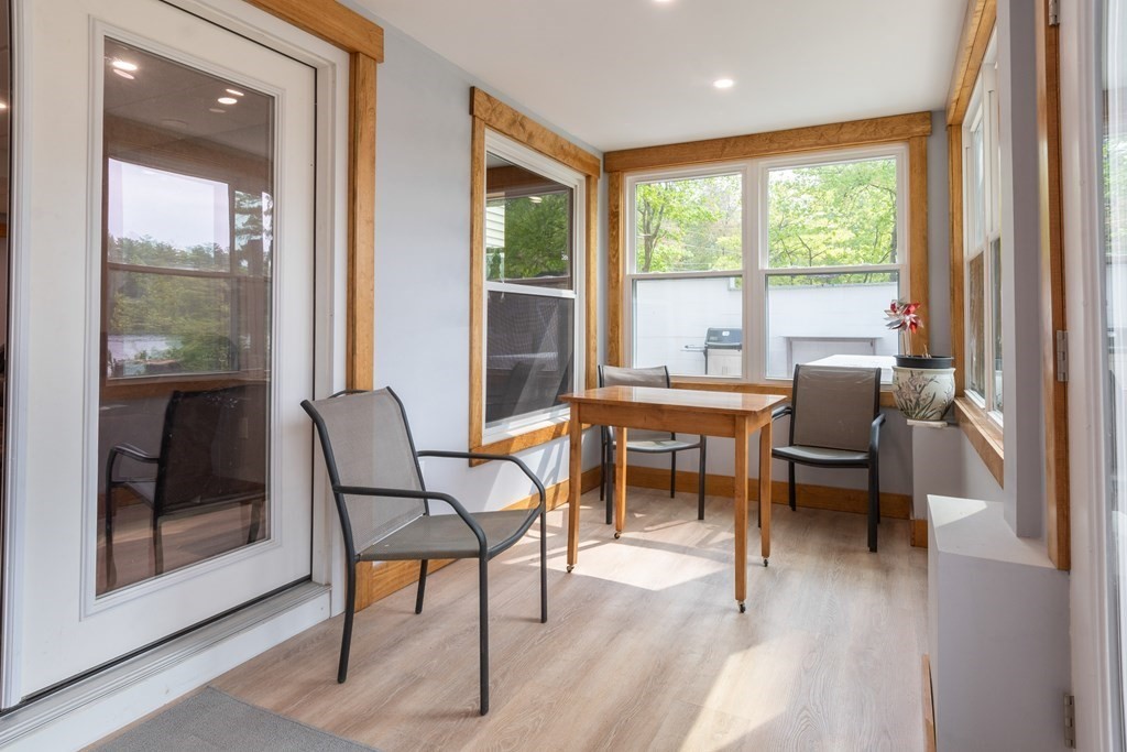 7 Sunset Drive Merrimack, NH 03054 - Photo 21 of 35 a dining room with furniture and wooden floor