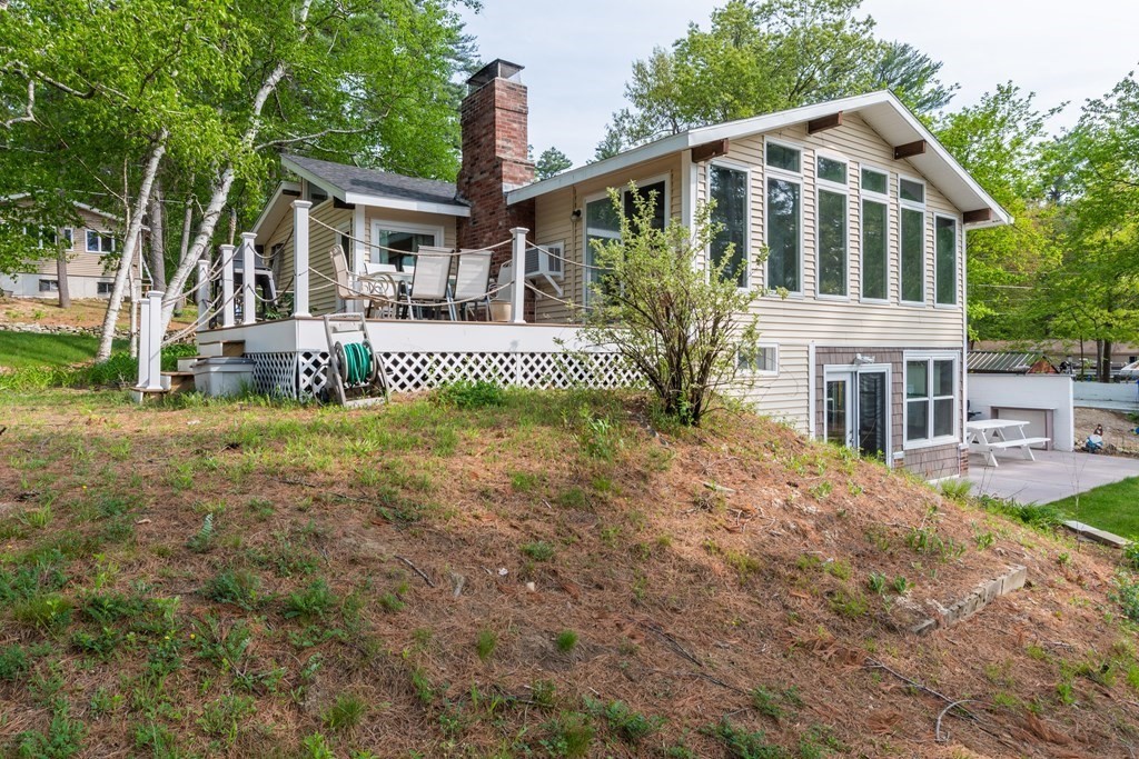 7 Sunset Drive Merrimack, NH 03054 - Photo 3 of 35 a front view of a house with a yard and porch