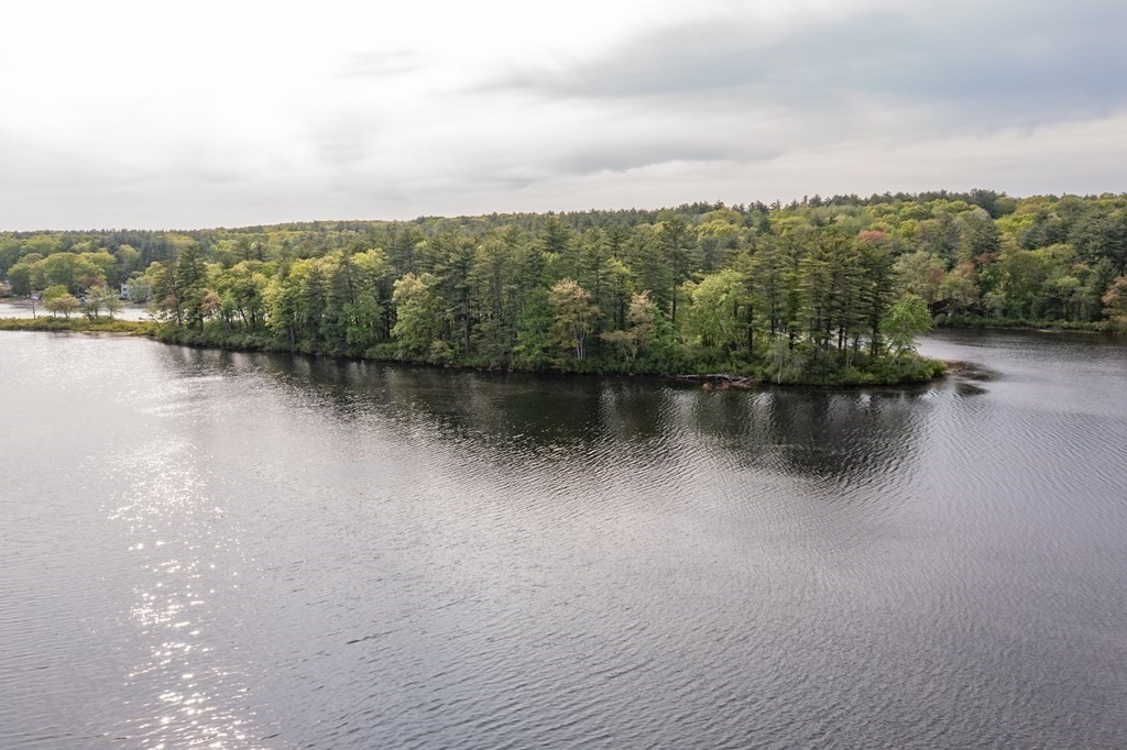 7 Sunset Drive Merrimack, NH 03054 - Photo 33 of 35 a view of a lake with houses in the back