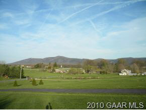 66 Spottswood Road Raphine, VA 24472 - Photo 12 of 12 a view of grassy field with mountain