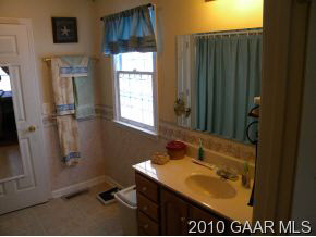 66 Spottswood Road Raphine, VA 24472 - Photo 6 of 12 a bathroom with a sink and a mirror