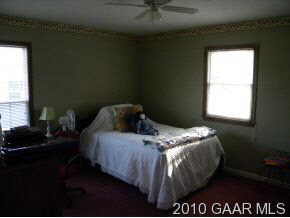 66 Spottswood Road Raphine, VA 24472 - Photo 8 of 12 a bed sitting in a bedroom next to a window