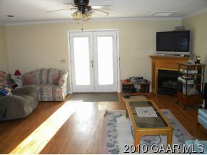 66 Spottswood Road Raphine, VA 24472 - Photo 10 of 12 a living room with furniture a flat screen tv and a fireplace
