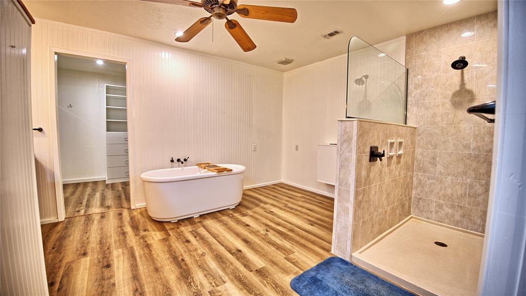 584 West Alamo Road Bowie, TX 76230 - Photo 11 of 40 a bathroom with a sink and a mirror