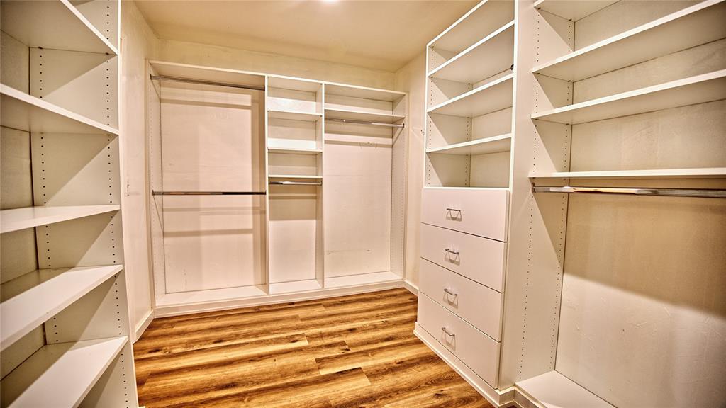 584 West Alamo Road Bowie, TX 76230 - Photo 13 of 40 a view of walk in closet with empty racks