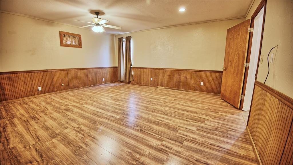 584 West Alamo Road Bowie, TX 76230 - Photo 15 of 40 a view of room with a ceiling fan