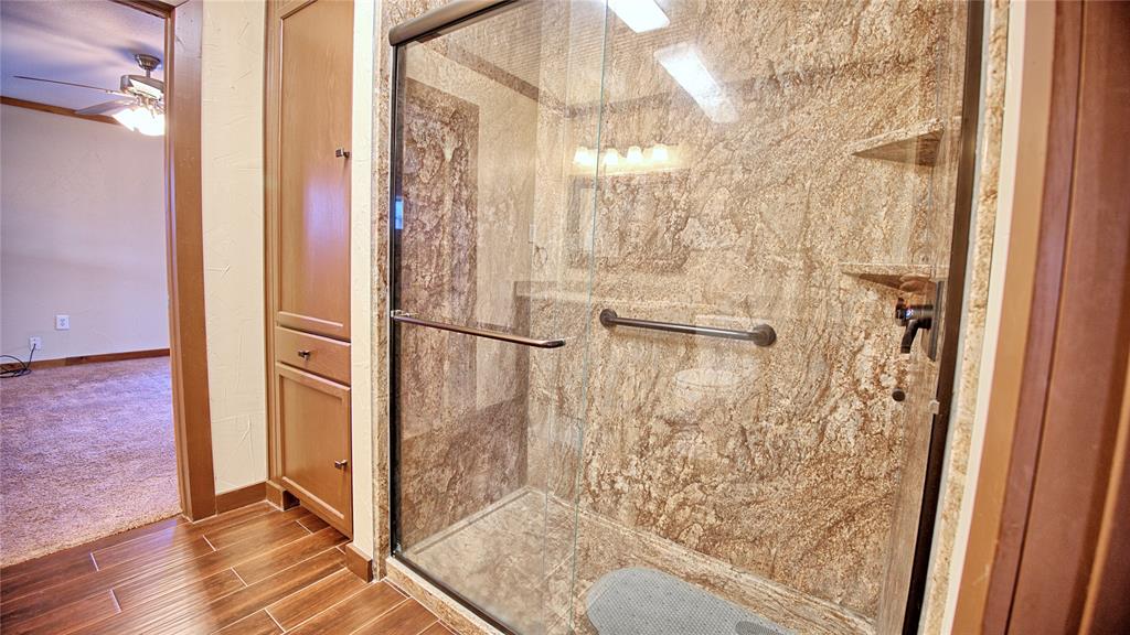 584 West Alamo Road Bowie, TX 76230 - Photo 16 of 40 a bathroom with a shower