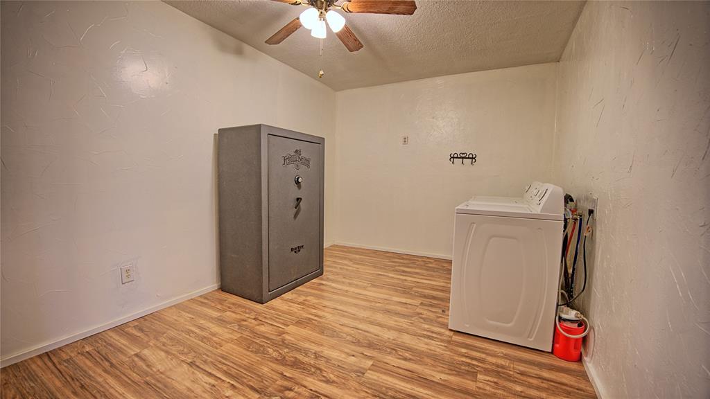 584 West Alamo Road Bowie, TX 76230 - Photo 19 of 40 wooden floor in an empty room