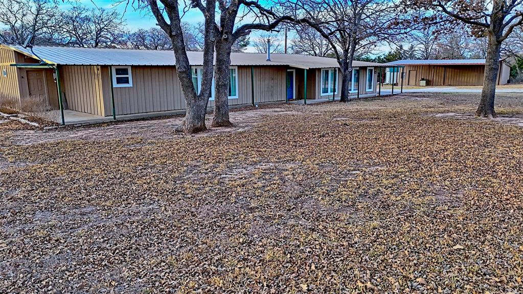 584 West Alamo Road Bowie, TX 76230 - Photo 24 of 40 a view of a house with a yard