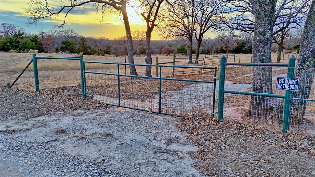 584 West Alamo Road Bowie, TX 76230 - Photo 29 of 40 a view of a yard with a tiny play house