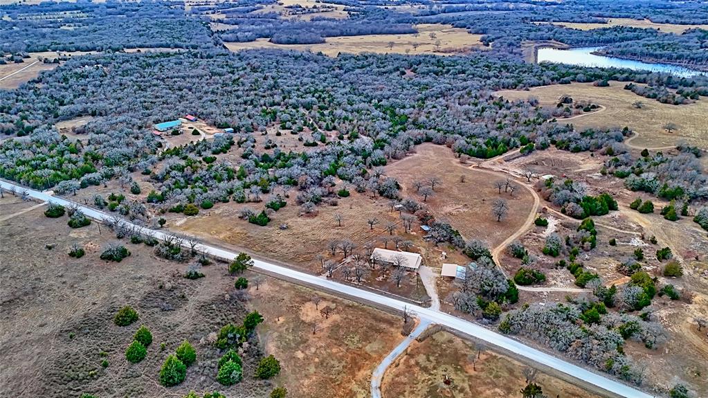 584 West Alamo Road Bowie, TX 76230 - Photo 34 of 40 a view of a wooden bridge