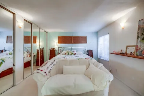 a bed room with a bed window and a couch