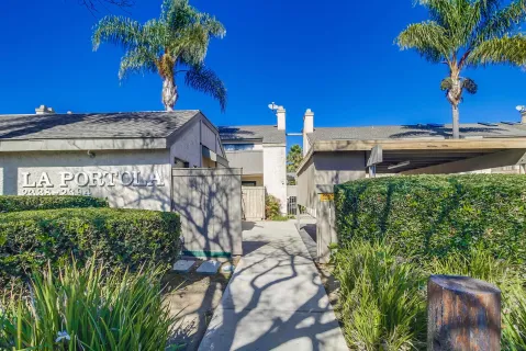 a view of a house with a flower garden