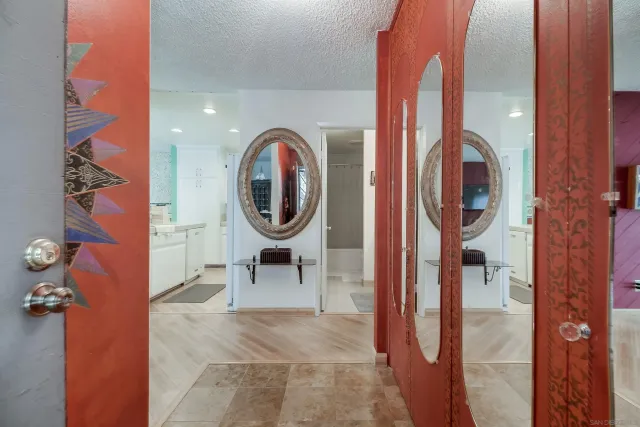 a view of a hallway with washer and dryer