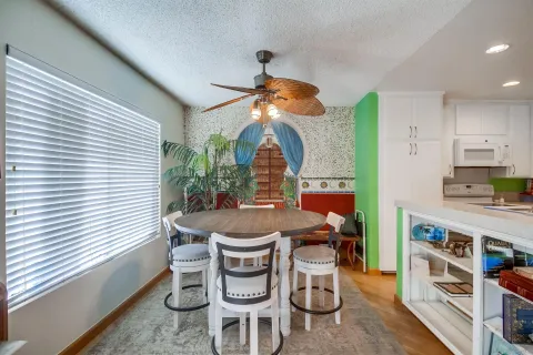 a dining room with furniture and window