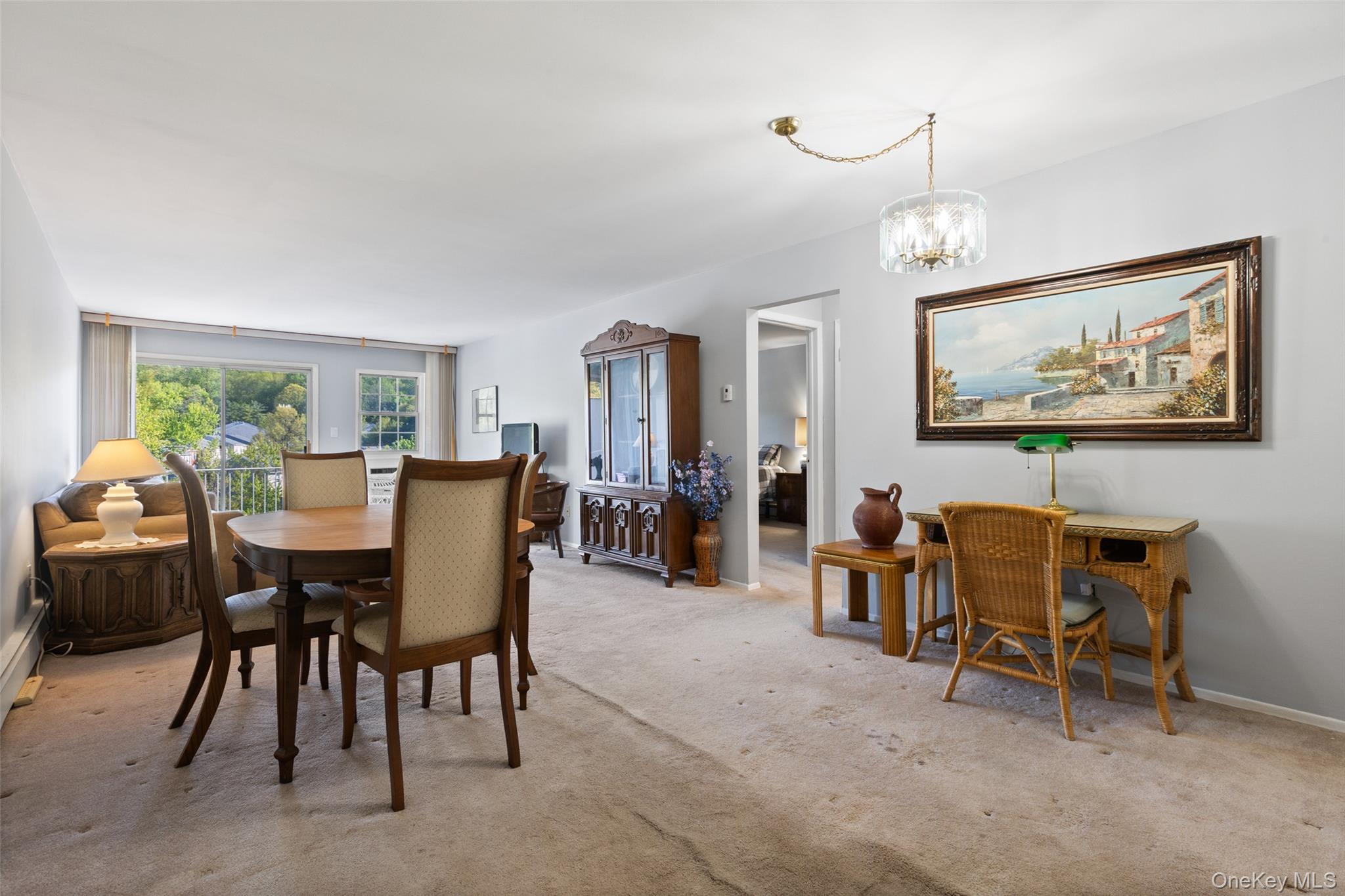 1840 Crompond Road, Unit 5C2 Peekskill, NY 10566 - Photo 5 of 27 a view of a dining room with furniture and chandelier