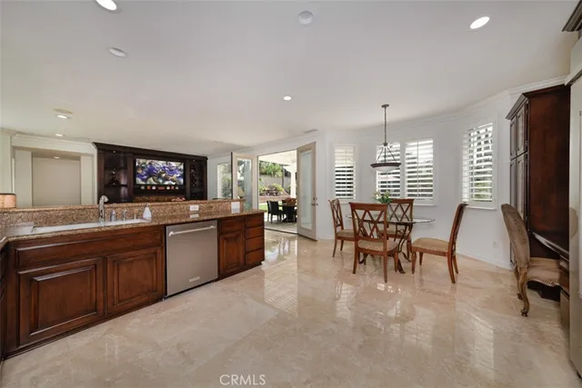 a large kitchen with a table and chairs