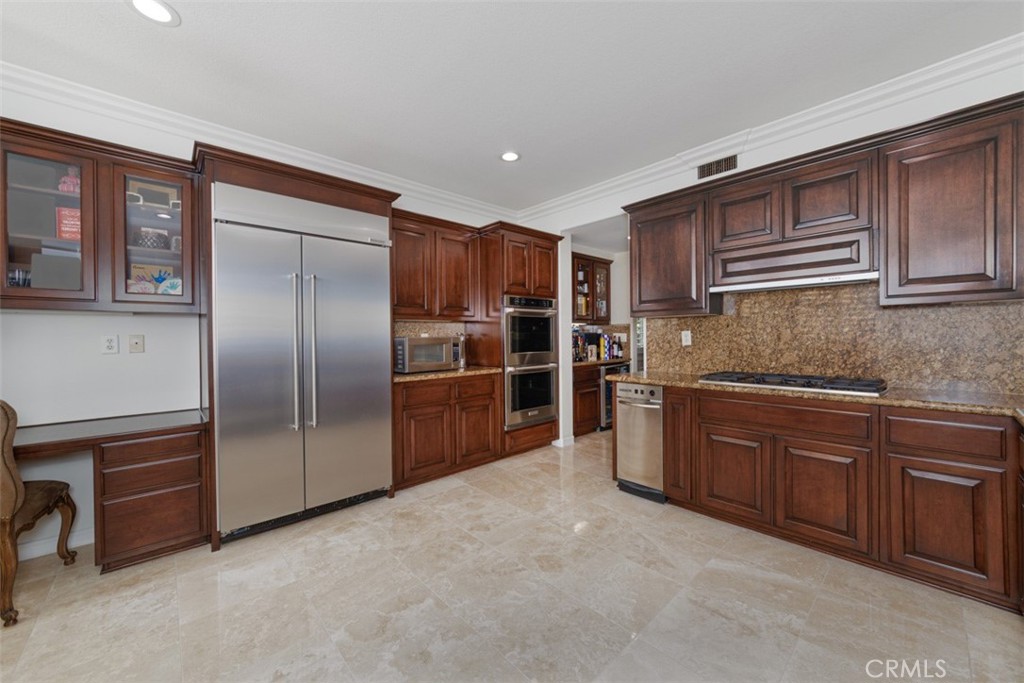 17722 Neff Ranch Road Yorba Linda, CA 92886 - Photo 11 of 63 a kitchen with stainless steel appliances granite countertop a refrigerator and a sink