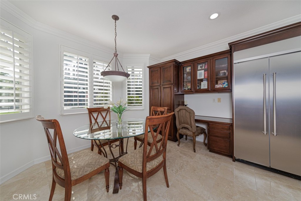 17722 Neff Ranch Road Yorba Linda, CA 92886 - Photo 13 of 63 Just off the kitchen, a sunlit breakfast nook frames a beautiful view of the backyard and pool. Built-in desk and refrigerator.