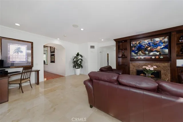 a kitchen with stainless steel appliances granite countertop a table and chairs in it