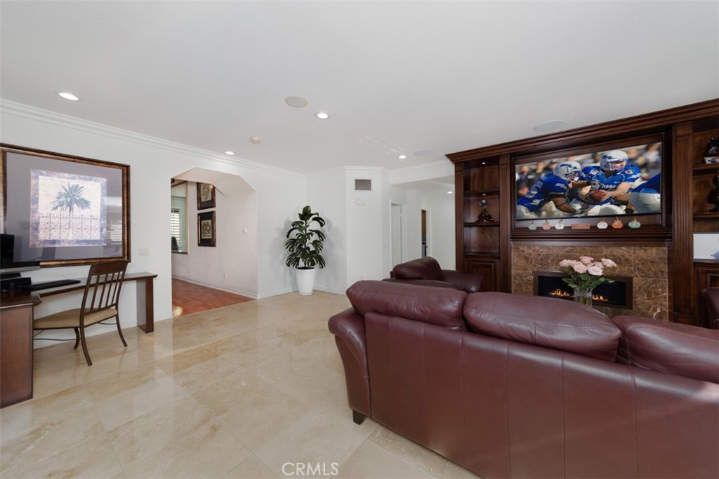 17722 Neff Ranch Road Yorba Linda, CA 92886 - Photo 16 of 63 a living room with furniture a flat screen tv and a floor to ceiling window