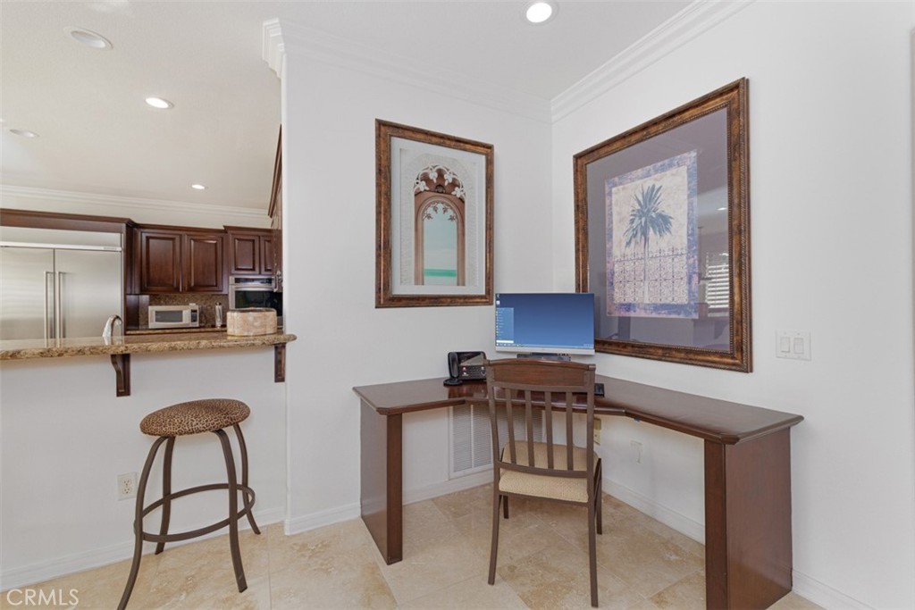 17722 Neff Ranch Road Yorba Linda, CA 92886 - Photo 17 of 63 A built-in desk off the kitchen provides the perfect spot to stay organized, manage daily tasks, or enjoy a dedicated workspace within the heart of the home.