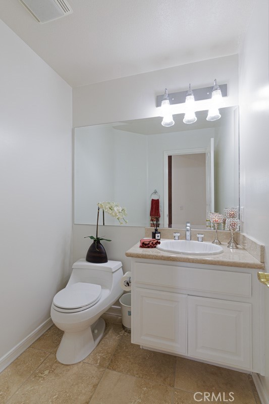 17722 Neff Ranch Road Yorba Linda, CA 92886 - Photo 19 of 63 a bathroom with a toilet sink and mirror