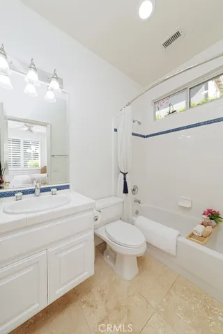 a bedroom with furniture and a couch