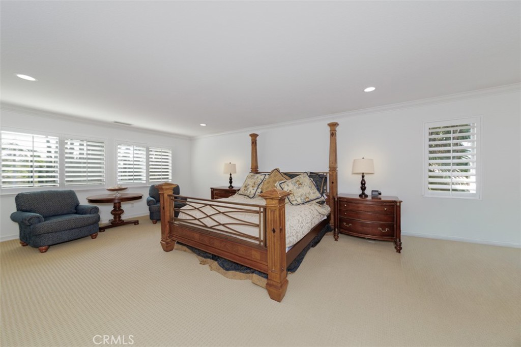 17722 Neff Ranch Road Yorba Linda, CA 92886 - Photo 24 of 63 a spacious bedroom with a bed and a couch