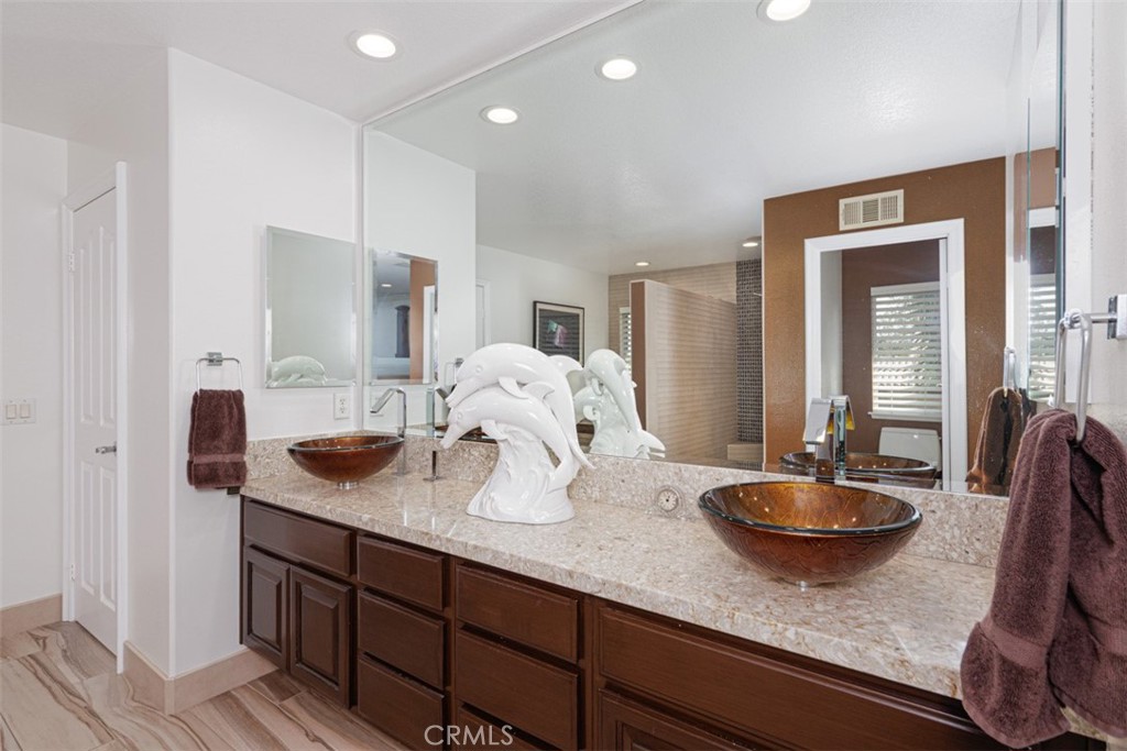 17722 Neff Ranch Road Yorba Linda, CA 92886 - Photo 26 of 63 Renovated primary bath with dual sinks and walk-in shower and oval bathtub.