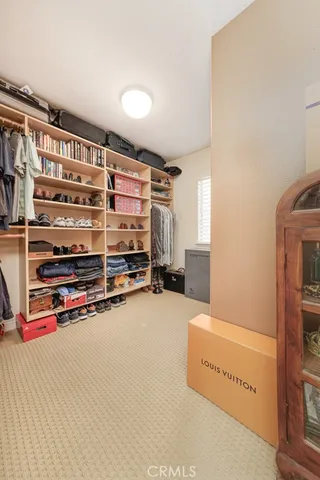 a bedroom with bed and a couch