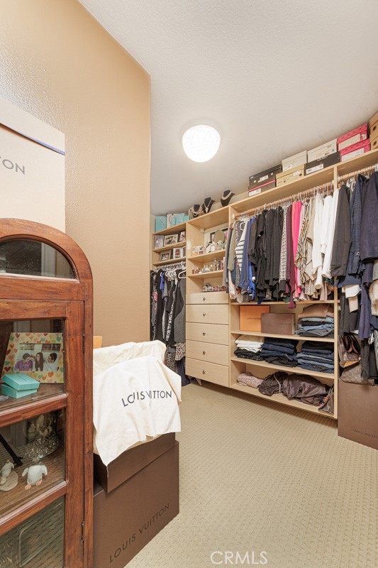 17722 Neff Ranch Road Yorba Linda, CA 92886 - Photo 28 of 63 a view of walk in closet with clothes and shoes