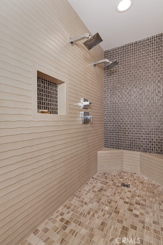 17722 Neff Ranch Road Yorba Linda, CA 92886 - Photo 29 of 63 Renovated primary bath with a walk-in shower featuring dual shower heads and a soaking tub for relaxation.
