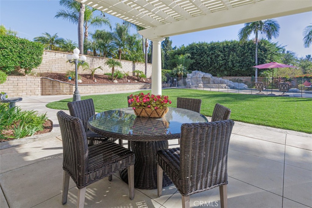 17722 Neff Ranch Road Yorba Linda, CA 92886 - Photo 43 of 63 a view of an outdoor dining space with a table and chairs