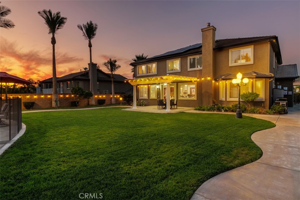 17722 Neff Ranch Road Yorba Linda, CA 92886 - Photo 46 of 63 a front view of a building with a garden and plants