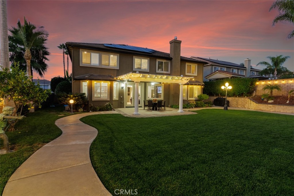 17722 Neff Ranch Road Yorba Linda, CA 92886 - Photo 48 of 63 a front view of a house with a yard table and chairs