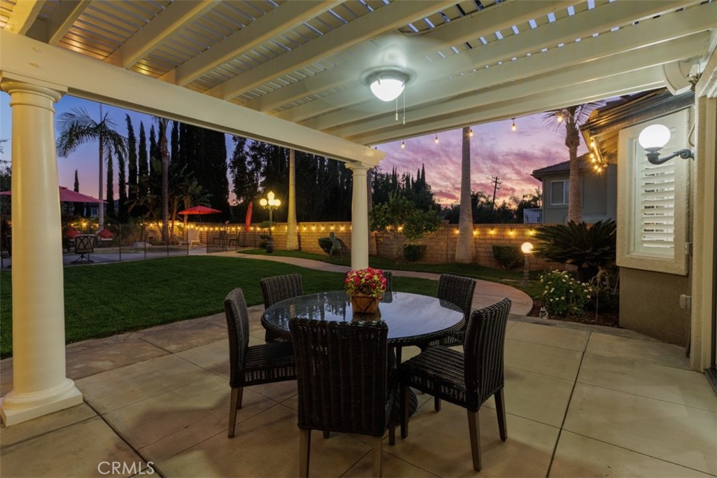 17722 Neff Ranch Road Yorba Linda, CA 92886 - Photo 50 of 63 a view of a patio with a dining table and chairs